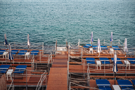Santa Maria di Leuca, Italy-June 2021: deck chairs on the beautiful coastiline in the southern part of Puglia