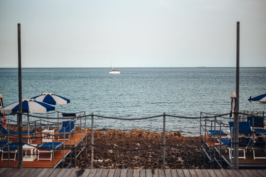 Santa Maria di Leuca, Italy-June 2021: deck chairs on the beautiful coastiline in the southern part of Puglia