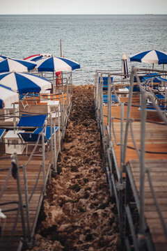 Santa Maria di Leuca, Italy-June 2021: deck chairs on the beautiful coastiline in the southern part of Puglia