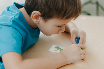 Close up of boy creating a diamond mosaic