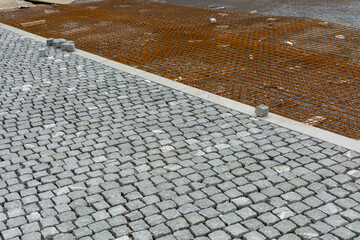 preparatory works in construction industry, road paved with setts, the reinforcing mesh