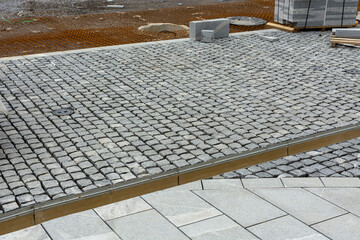 preparatory works in construction industry, street paved with setts, the reinforcing mesh and stormwater drainage channel