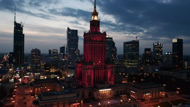 Slide and pan shot of PKIN building. Evening footage of downtown with high rise towers against twilight sky. Warsaw, Poland