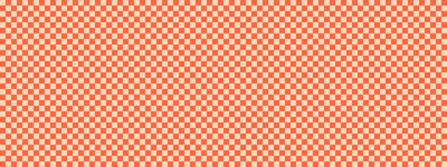 Checkerboard banner. Tomato and Apricot colors of checkerboard. Small squares, small cells. Chessboard, checkerboard texture. Squares pattern. Background.