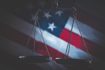 Conceptual image of scale of Justice against American flag background as symbol of equality and...