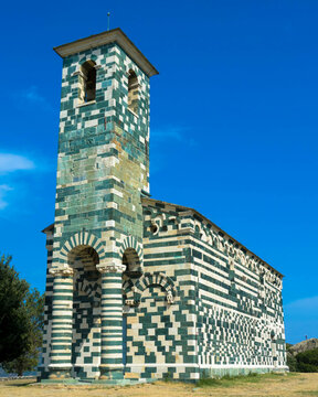 View of the famous Church of San Michele de Murato, a small chapel in polychrome stones and typical pisan romanesque style in village of Murato, Haut-Corse, France