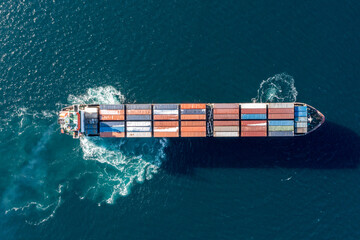 Sea container ship is moving at sea.