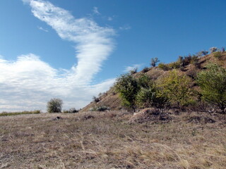 Panorama of the blue barely cloudy sky over the Dnieper steppes on a sunny autumn day.