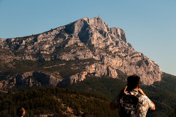 Fototapeta premium person on the top of the mountain Sainte-Victoire