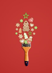 Creative Christmas concept composition. Paint brush with Holliday cookies