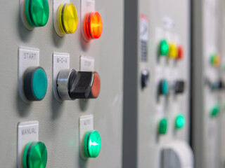 Electrical selector switch,button switch,Electrical switch gear at Low Voltage motor control center cabinet in coal power plant. blurred for background.