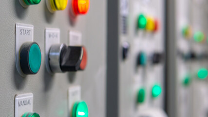 Electrical selector switch,button switch,Electrical switch gear at Low Voltage motor control center cabinet in coal power plant. blurred for background.