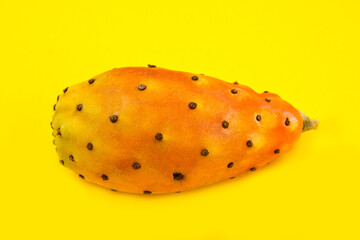 close up of Opuntia ficus indica, exotic fruit on yellow background