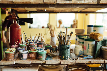 Hands of a potter. Potter making ceramic pot on the pottery wheel