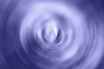 Trendy very peri color concept of the year 2022, violet blue, lavender blurred gradient radial motion background. Circular texture