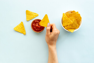 Mexican snacks nachos with salsa sause. Fast food background