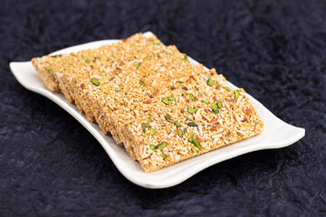 Winter Delicacy Makar Sankranti Or Lohri Mithai Pista Gajak Also Known As Gur Gajjak, Gazak, Gachak Til Patti Or Papdi, Chikki Is Made Of Tilgul, Sesame Seeds, Jaggery Gud Almonds Badam And Pistachio