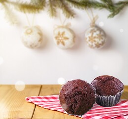 Christmas cakes, puddings or cupcakes on kitchen desk