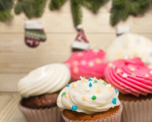 Christmas cakes, puddings or cupcakes on kitchen desk