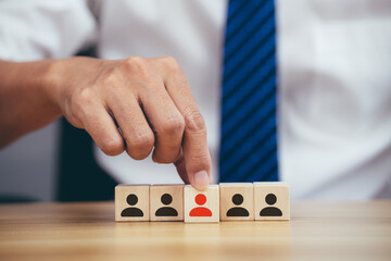 Man hands holding cube with many human symbol, leadership and corporate hierarchy concept.