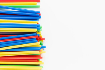 Pack of colorful plastic straws on white background. Recycle, environment conversation, pollution and plastic recycle concept. Copy space