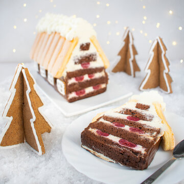 Cake - Christmas cottage. Sponge cake with cream cream with the addition of cherries.
