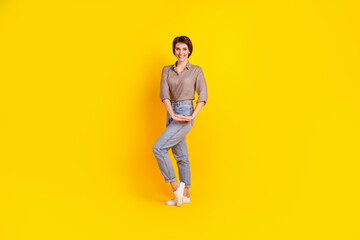 Fototapeta na wymiar Full size photo of young attractive woman good mood wear casual outfit isolated over yellow color background