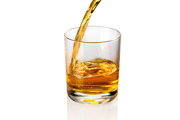 Whisky, whiskey or bourbon  pouring into whisky glass isolated on white, copy space