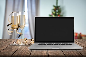 Laptop on the christmas table. Video call with the family in times of coronavirus.