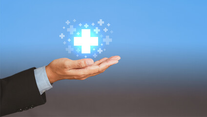 Health care and business health insurance concept. Space for text. Virtual medical icons on the palm