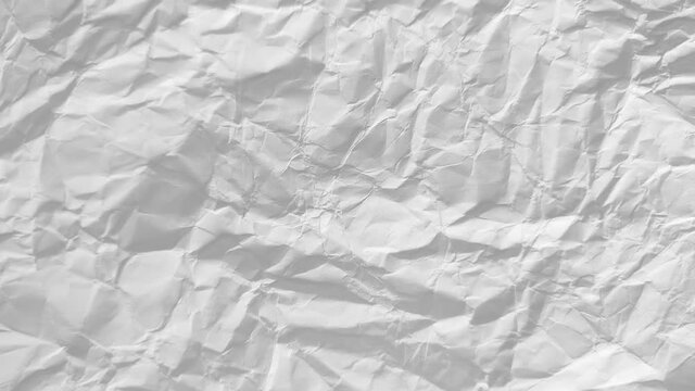 Stop motion animation of white crumpled paper texture background. Blank empty sheet of paper. Space for text. Frame-by-frame stopmotion sequence. Video luma mattes. Seamless looping