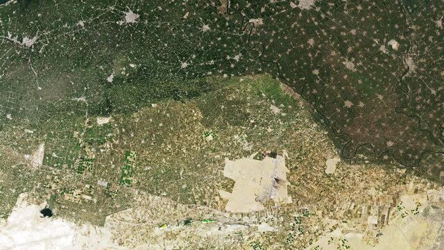 Farmland desertification global warming and urban growth time lapse Egypt city of Alexandria, aerial satellite view from space. Based on images furnished by Nasa