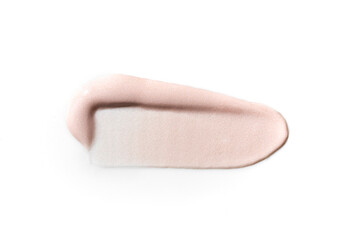 Light pink cosmetic product smear on the white background. Close up