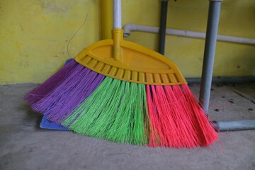 colorful brooms on the floor