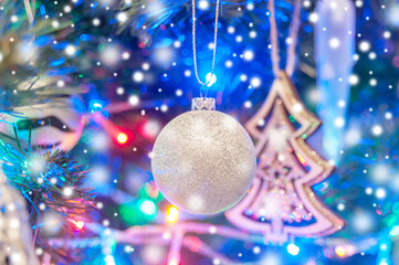 Christmas decorations on a Christmas tree with snow. Xmas card