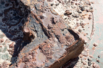 Old rusty parts of an abandoned sea beacon or buoy at the beach in Atlantida, Canelones, Uruguay
