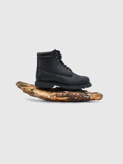 Photo of black winter boots on a white background