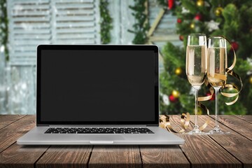 Laptop on the christmas table. Video call with the family in times of coronavirus.