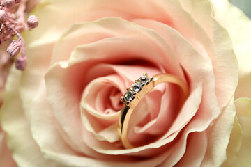 Beautiful wedding bouquet with wedding ring, close up
