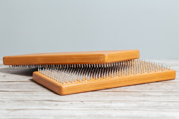 Brown Sadhu wooden boards with nails for yoga and spiritual practices on the grey background. The concept of meditation, standing on nails, therapy.