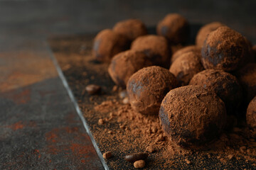 Concept of sweets with truffles on dark textured background