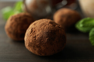 Concept of sweets with truffles on dark wooden background