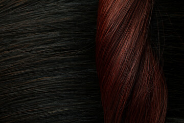 Dark and red female hair on whole background