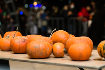 There are many pumpkins on the table