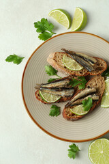 Concept of tasty snack with sandwiches with sprats