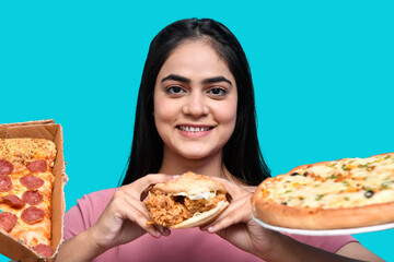 foodie girl standing front smiling ignore pizza and holding burger indian pakistani model