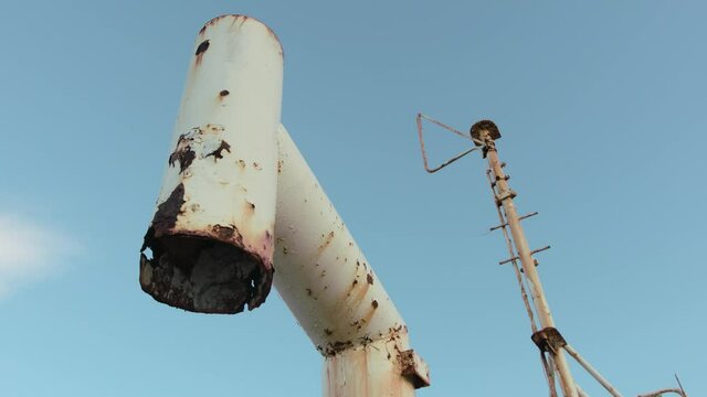 A view of an old rusty antenna, a broken radio signal on the shipwreck