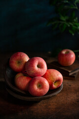 Fresh apples on the  wooden table