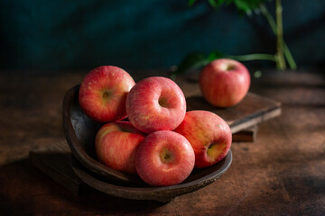Fresh apples on the  wooden table
