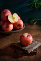 Fresh apples on the  wooden table